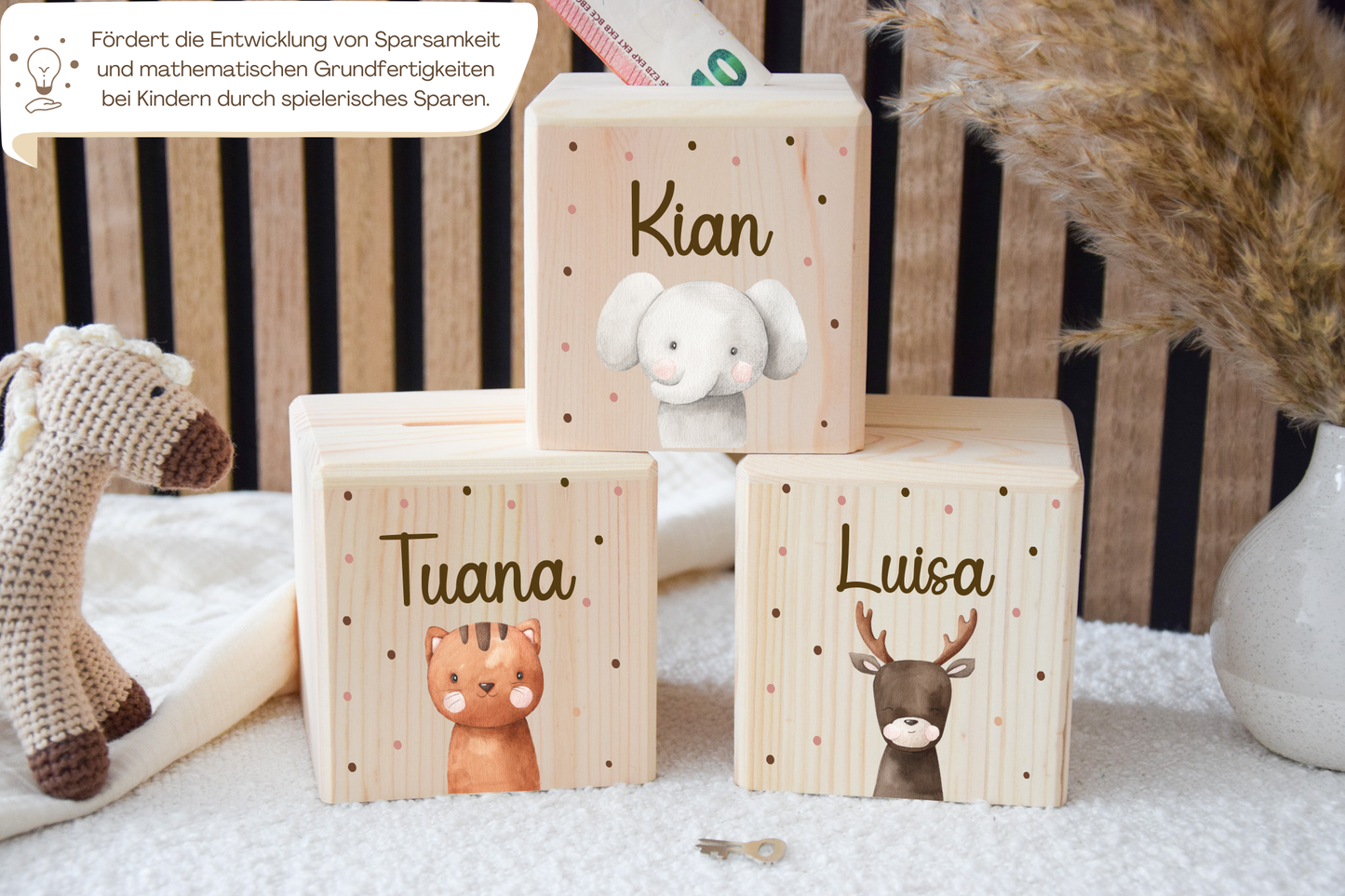 Salvadanaio con motivi di animali e pois colorati